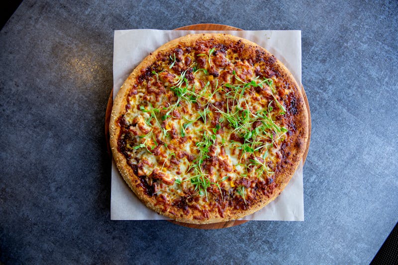 Pizza Ranch kitchen team preparing fresh pizzas during a busy service